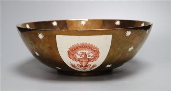 A large Grays pottery copper lustre American armorial bowl, printed with shield crests in iron red, 31cm